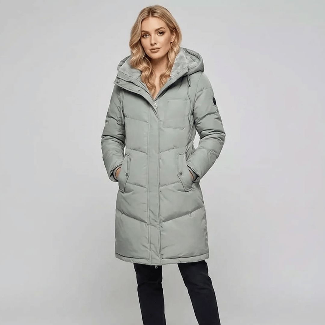 Women's padded parka in pastel green, worn outdoors