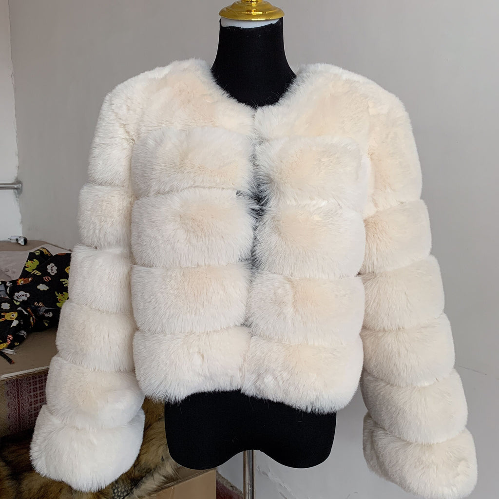 Women's faux fur coat, close-up of the collar and sleeves